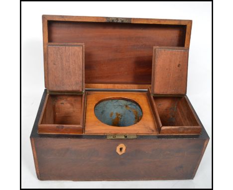 A 19th century flame mahogany and rose wood cross banded tea caddy having a hinged lid opening to reveal twin drop in caddies