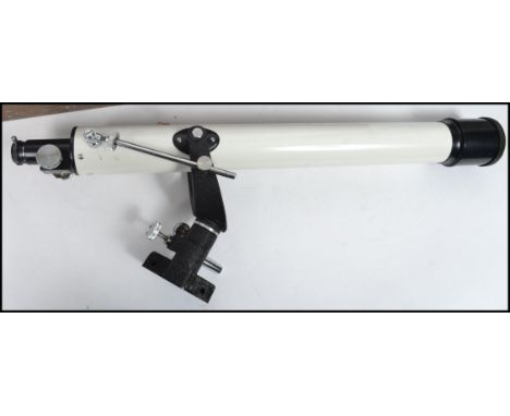 A vintage 20th century cased telescope. Made in Japan, the white telescope complete with the wooden tripod and set in a woode