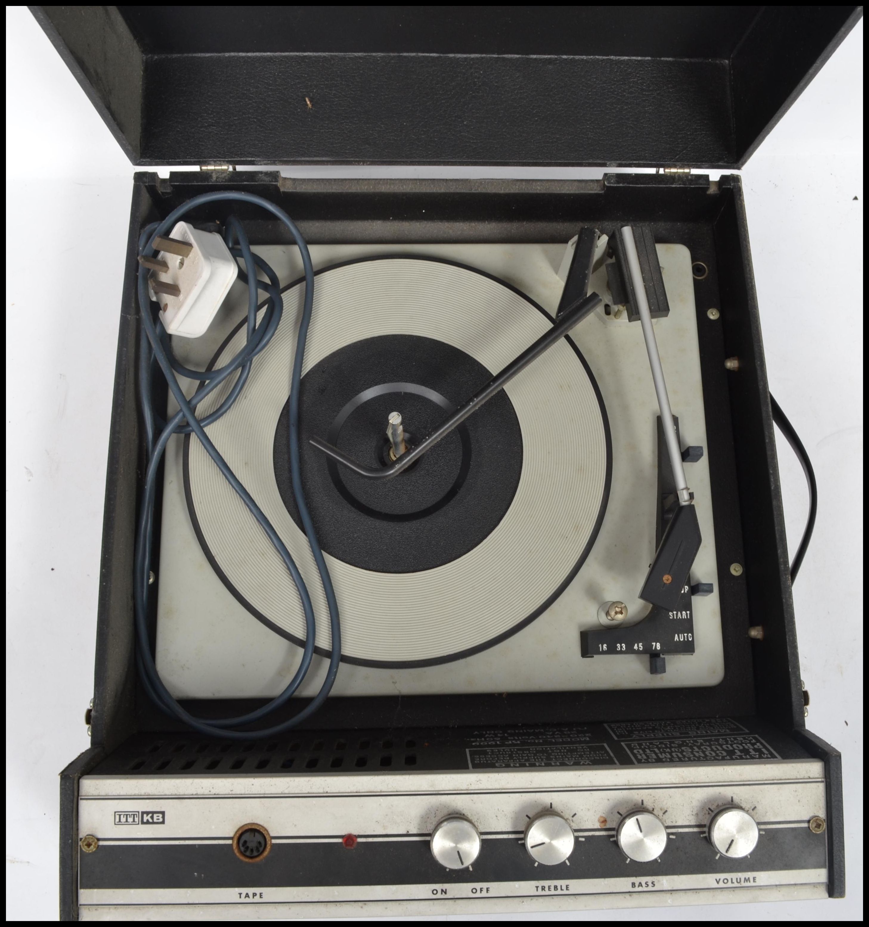 A vintage 20th century portable four speed record player by ITT KB. Lift up lid, built in speaker