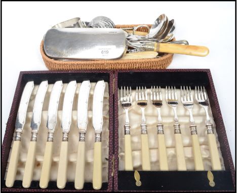 A group of fine vintage silver plated flatware to include sifter spoons, ladles, tongs, caddy spoons, napkin rings, carved bo