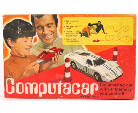 A vintage retro Mettoy Computacar set complete with 6x bollards, course cars &amp; instructions. Within the original box.&nbs