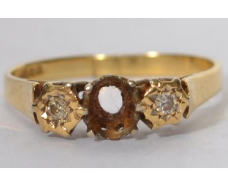 A vintage 18ct gold / 750 marked ladies 3 stone diamond ring  ( missing central stone ) The ring with classic setting, marked