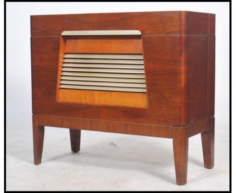 A stunning Art Deco walnut cased radiogram by Pye. Bakelite louvre speaker grill to front with a Garrard RC type 65 turntable