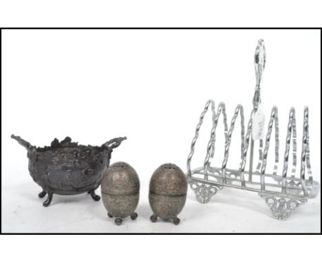 A 19th century pewter rococo cauldron table salt bowl with twin handles together with a pair of 19th century silver plated sa