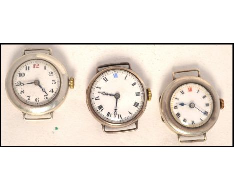 A group of 3 vintage early 20th century ladies silver wristwatches, each without straps. The watches with good faces, winders