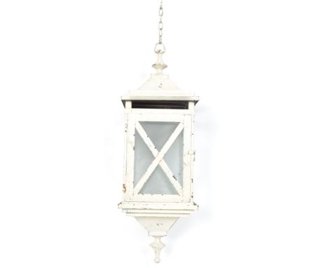 A vintage 20th century four panel hanging porch lantern with angular and finial tops, painted in a white finish.
