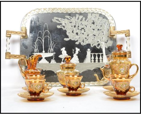 A vintage retro 20th century Murano studio art glass tea service having cups, saucers, sugar bowl, milk creamer jug, tea pot 