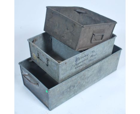 A collection of vintage mid century Industrial tote tray's each of rectangular form with ribbed edges and handles to the ends