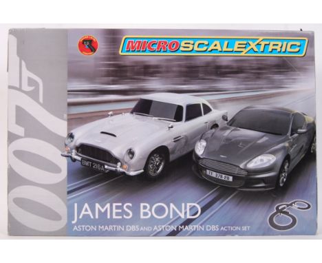 An original Micro Scalextric 1/64 scale James Bond Aston Martin DB5 &amp; Aston Martin DBS slot car action set. Appears mint 