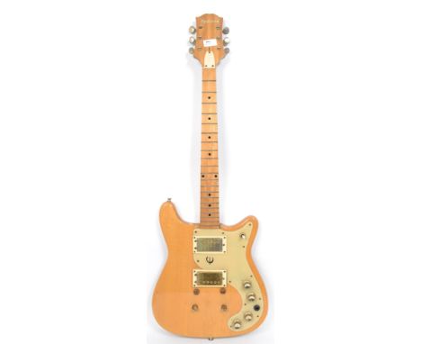 A vintage 1970's Epiphone ET Series made electric six string guitar having a shaped maple body with cream scratch guard and e