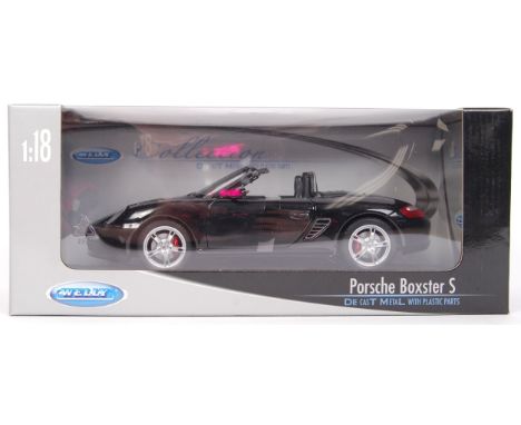 An original Welly Diecast made 1:18 scale black Porsche Boxster S diecast model car. Appears mint, within the original box.&n