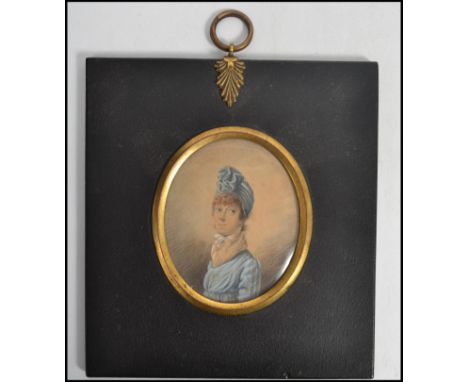 A 19th century Victorian watercolour and gauche portrait miniature tondo painting of a lady set to an ebonised square frame w