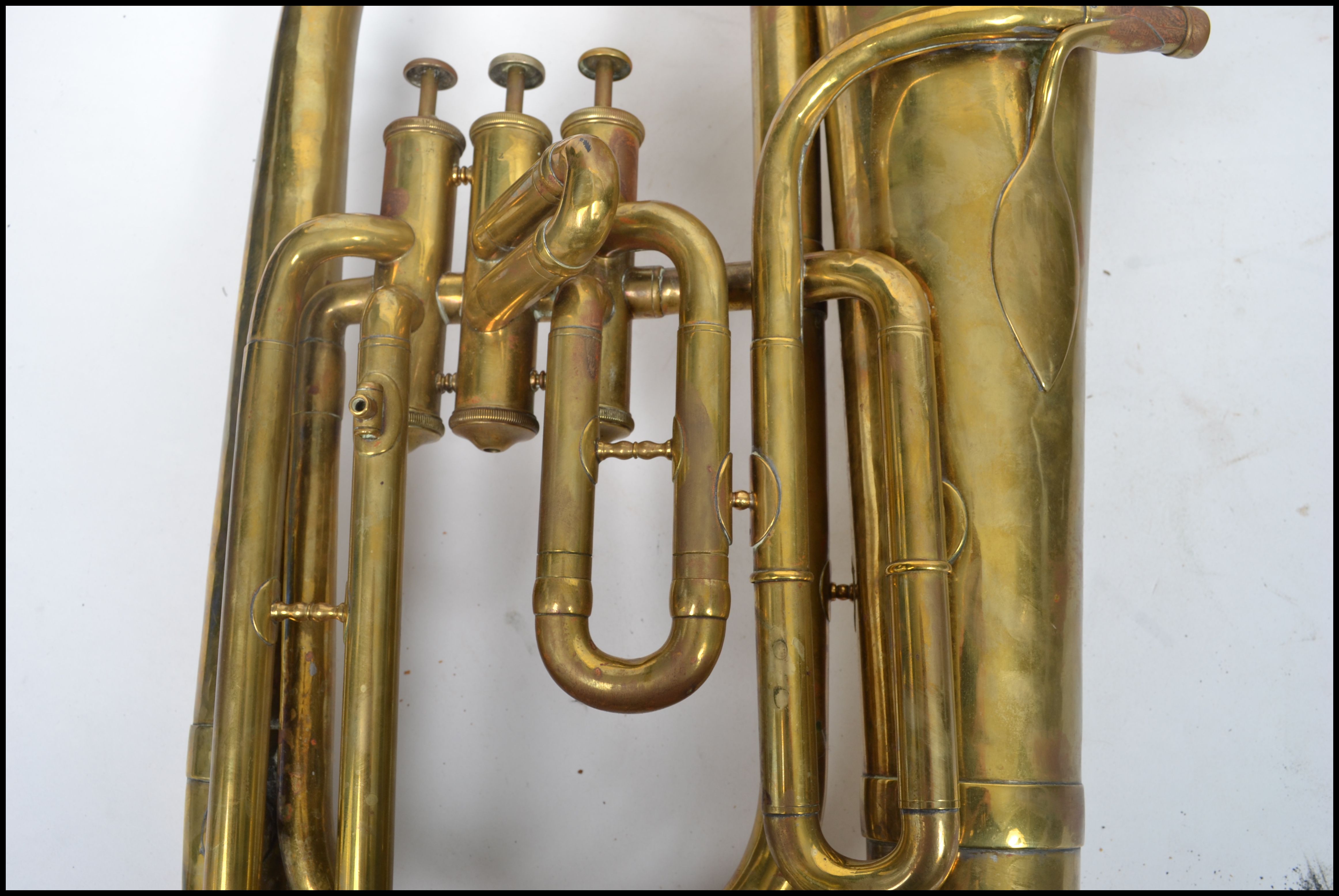 A vintage 20th century brass tuba musical instrument by A Hall Gisborne