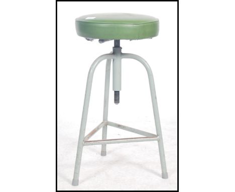 A vintage mid 20th century retro industrial machinist stool by Shaw of tubular construction raised on an adjustable tripod ba