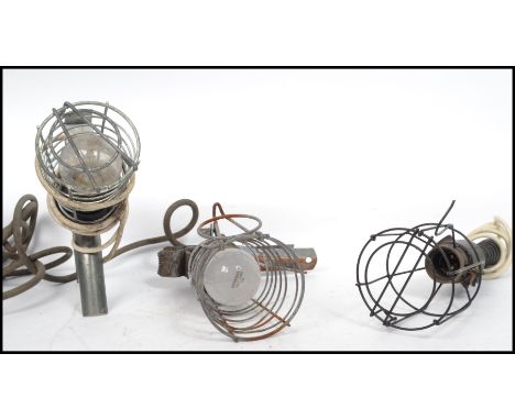 A good group of vintage 20th century retro industrial inspection lamps with clamp ends and wire cages. Measures 37 cm long.