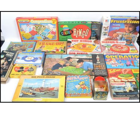 A collection of vintage board games to include Waddingtons Table soccer, Bingo, Beetle Drive, Frame-up, Happy New Year, Waddi