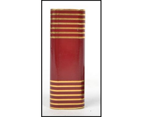 A vintage Cartier Paris gilt and red enamel banded cigarette lighter. Model No 35747L Complete with the leather protective ca