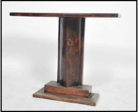 A 1930's Art Deco / early 20th century stained pine console table having a tapering boat shaped column raised on squared plin