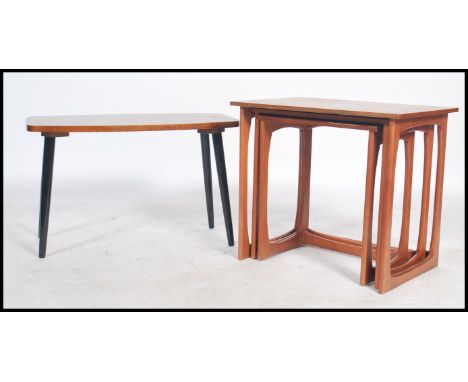 A vintage 20th century Danish style teak wood nest of tables ( 3 ) toegether with a 1960's coffee table being raised on atomi