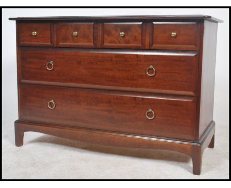 A Stag mahogany ' minstrel ' bedroom chest of drawers with four short drawers over two long drawers raised on bracket feet.