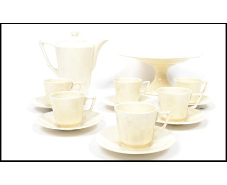 A vintage 20th century Crown Ducal six person tea service consisting of cups, saucers, teapot, tazza cake plate etc. Highest 