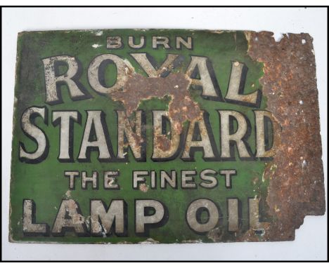 A vintage early 20th century enamel double sided point of sale advertising sign for Royal Standard Lamp Oil. On green ground 