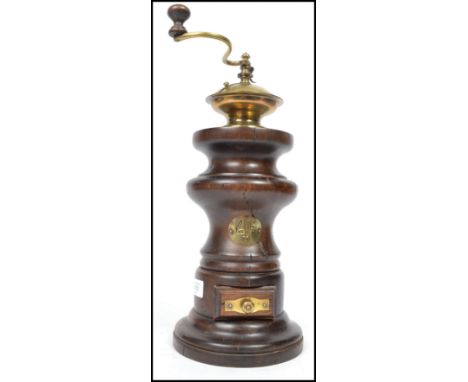A good early 20th century large French wooden coffee grinder of wooden and brass construction. The top with brass cap and han