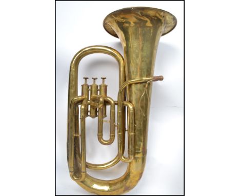 A vintage 20th century brass tuba musical instrument by A Hall Gisborne makers to H M Forces Apollo Works Vere Street Birming