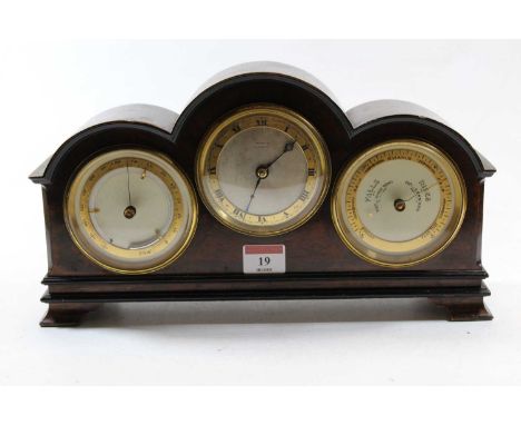 A burr walnut cased mantel clock, the case of domed rectangular form, the central silvered dial with gilt chapter ring and Ro