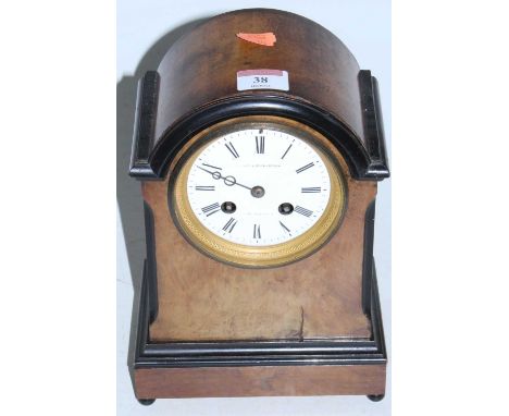 A late Victorian walnut and ebonised cased dome top mantel clock, the circular enamel dial with Roman numerals signed Vale &a