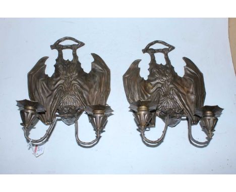 A pair of modern pressed metal twin sconce wall light fittings each in the form of a bat, height 34cm