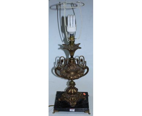 A large gilt metal table lamp of urn shape, raised on a marble plinth, height 43cm (excluding fittings)