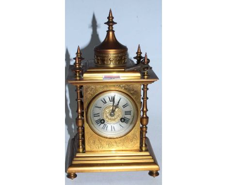 A late 19th century brass cased mantel clock having a circular silvered dial with Roman numerals and eight day movement strik