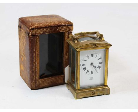 An early 20th century lacquered brass cased carriage clock having a domed top, initialled EB from The Lincoln Ladies Hockey C