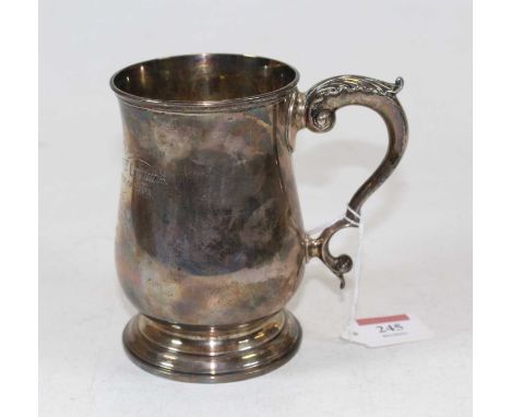 A Victorian silver tankard of bell shape with inscription, "Presented by the Town Council of Bury St Edmunds, for the Pen of 