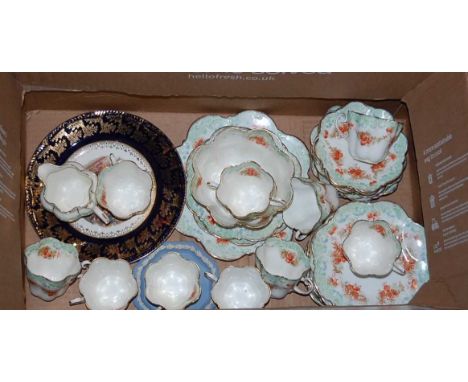 A Victorian part tea service transfer printed with pink flowers within green floral borders together with two cabinet plates,