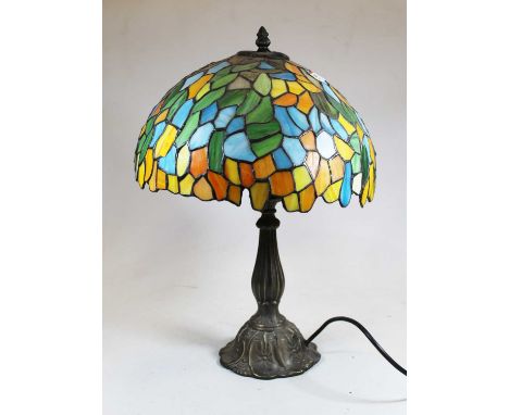 A reproduction lamp in the Tiffany style, having domed leaded glazed shade, on a fluted Art Nouveau style baseCondition repor
