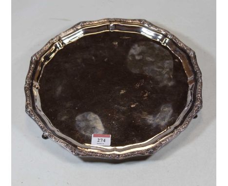 A modern silver salver, the raised piecrust border decorated in the Celtic style on cast feet, maker Mappin &amp; Webb, Sheff