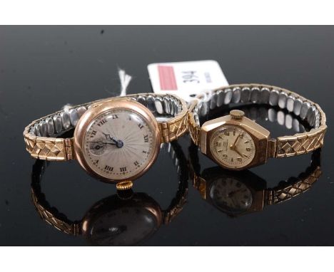 A lady's 9ct gold cased mechanical wristwatch, having fine engine turned dial and subsidiary seconds, case dia.26mm, on repla