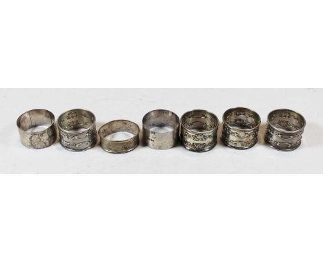 A set of four early 20th century American silver napkin rings, each having repousee C-scroll decoration and engraved Gorham S