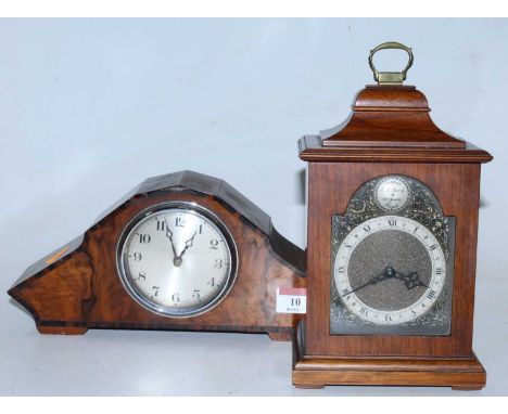 An Art Deco walnut and rosewood crossbanded mantel clock having a silvered dial with Arabic numerals and cylinder movement, h