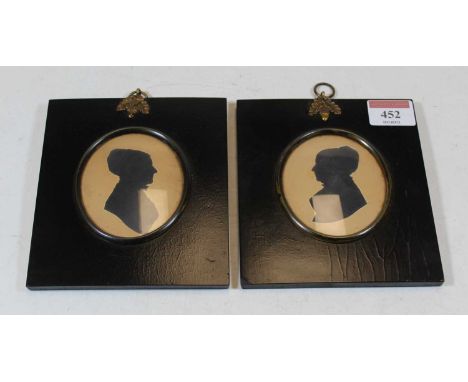 English school, 19th century, portrait silhouette of a lady in profile, framed as an oval in ebonised outer frame, hand-writt