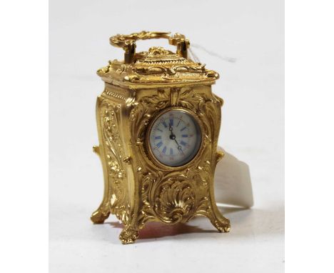 A modern gilt metal cased minuet carriage clock in the French style, having circular dial with Roman numerals and Arabic oute