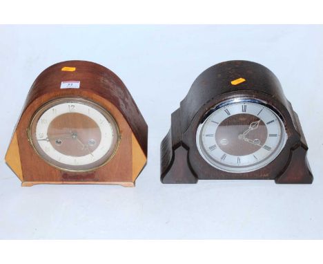 A 1950s Smiths oak cased mantel clock having a silvered dial with Roman numerals and eight day movement together with one oth