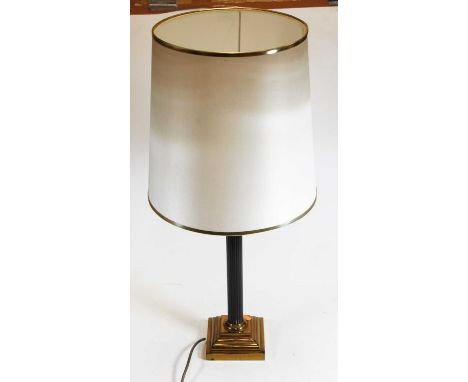 A contemporary Corinthian column table lamp, with conical shade on a stepped brass base