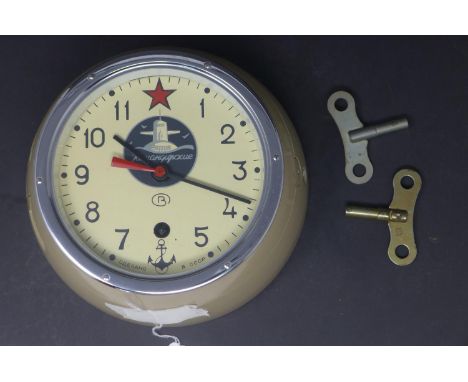 A Russian bulkhead clock by Kuamqupckue, the round dial with Arabic numerals, signed to dial and with image of submarine, Dia