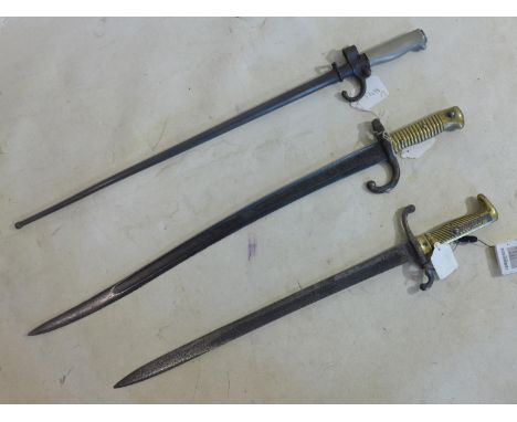 Three 19th century bayonets to include a French 1866 Chassepot bayonet bearing various markings and inscriptions; a lebel epe