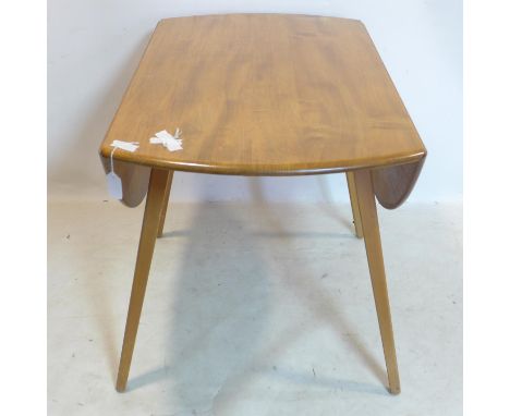 An Ercol elm drop flap dining table, H.72 L.112cm 