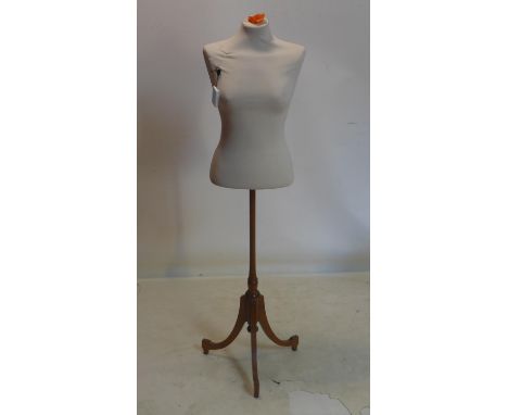A modern mannequin on 19th century mahogany base 