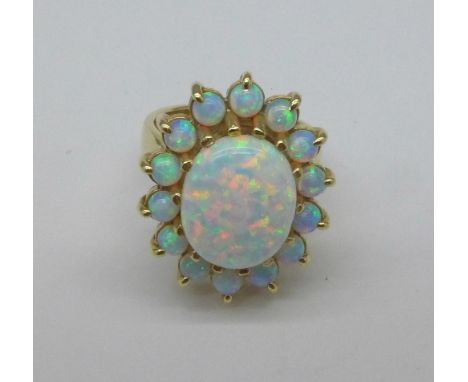 A 9ct gold and synthetic opal ring, 8.2g, L